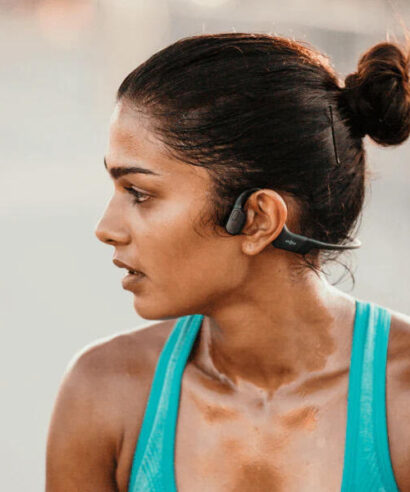 Woman exercising wearing aftershokz